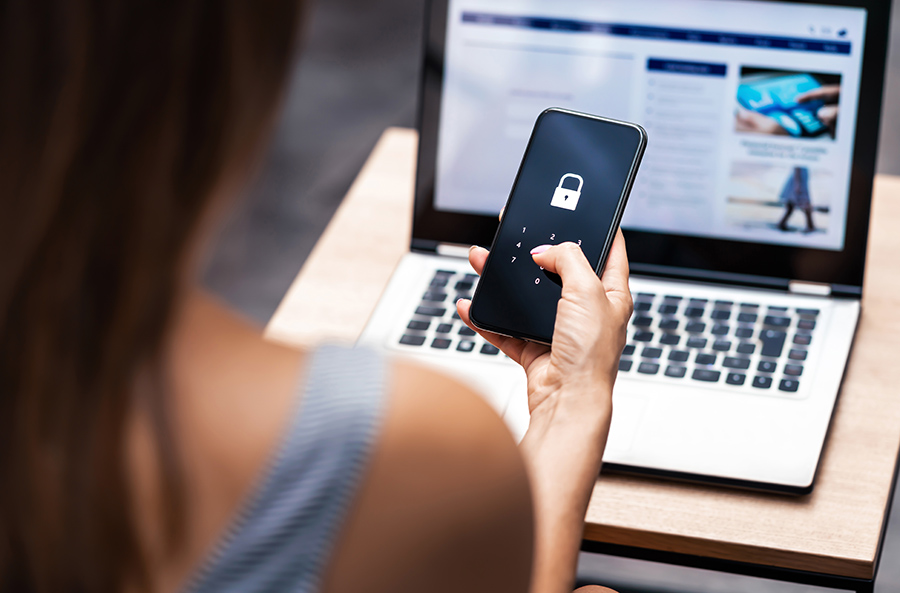 Woman holding a smartphone with 2fa (two factor authentication).